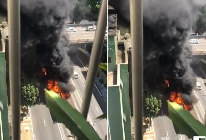VÍDEO - Ônibus articulado pega fogo em avenida movimentada