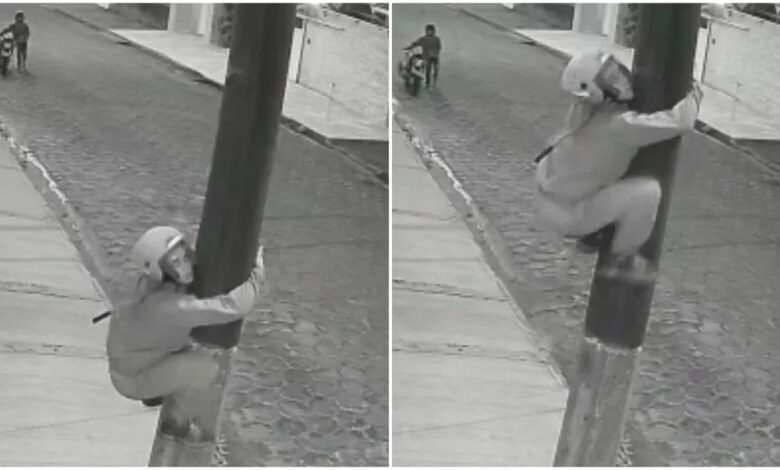 Homem escala poste para furtar fios de energia em Peruíbe, SP
