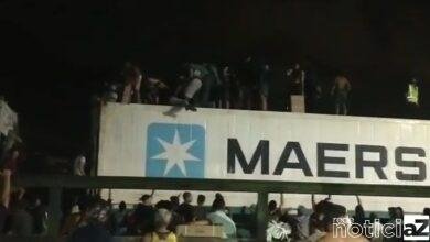 VÍDEO - Multidão saqueia contêiner de carne em Cubatão