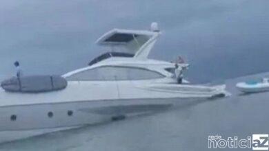 VÍDEO - Lancha encalha e tripulantes são resgatados no Litoral