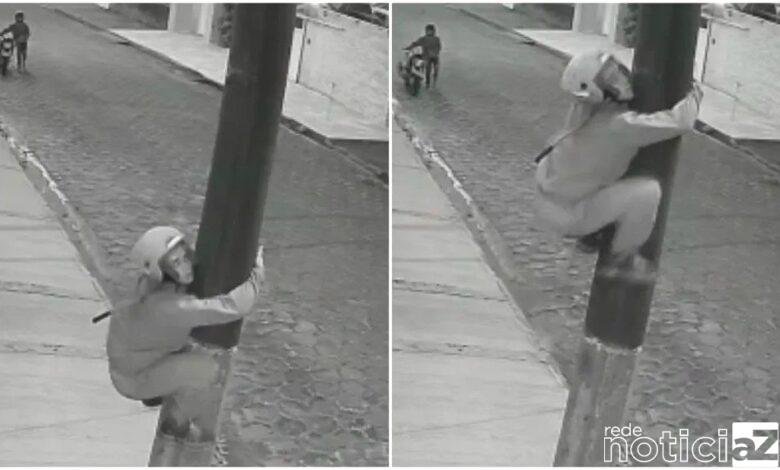 Homem escala poste para furtar fios de energia em Peruíbe, SP