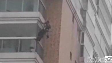 VÍDEO - Homem fica pendurado por corda em fachada de prédio